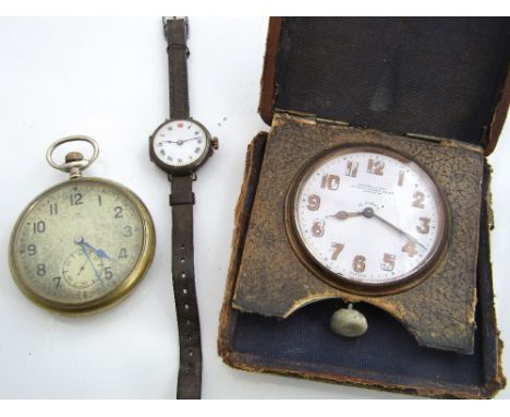 A vintage eight day folding leather cased travel clock, inscribed Edward & Sons of Regent Street London; together with a furt