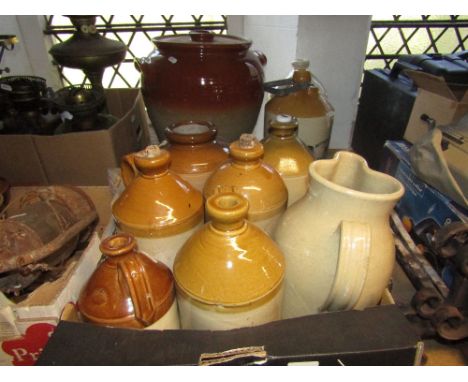 A small collection of vintage stoneware flagons and jars and a large partially glazed crock and cover