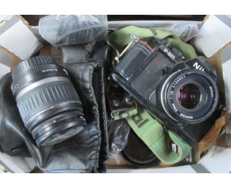 A Nikon camera together with lens
