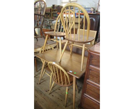 An Ercol style kitchen table and four chairs&nbsp;