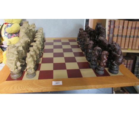 A chess set with resin animal figures