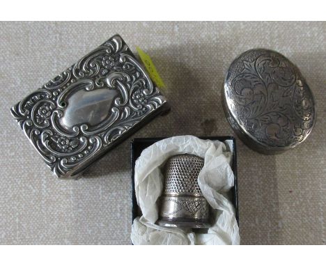 A silver oval trinket pot, together with a silver match box cover and a thimble