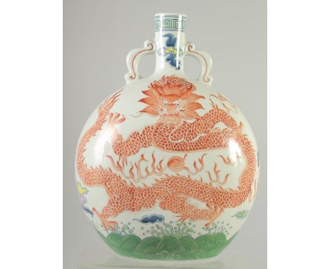 A CHINESE CORAL RED AND WHITE PORCELAIN MOON FLASK, painted with large central dragon and flaming pearl of wisdom to front an