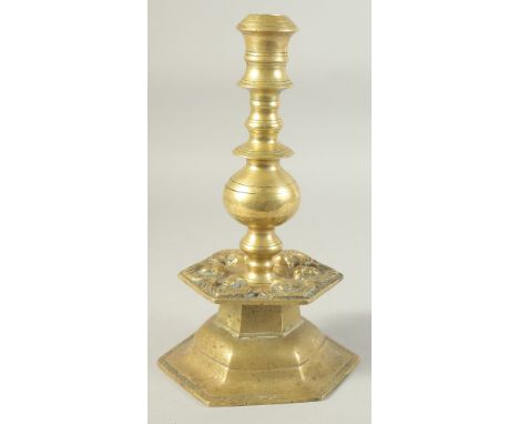 AN UNUSUAL 18TH-19TH CENTURY POSSIBLY OTTOMAN ARMINIAN BRASS CANDLESTICK, depicting angels around the base, 28cm high.