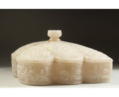 A FINE ADVENTRINE OR ROCK CRYSTAL LEAF-FORM LIDDED BOX, the lid and sides carved with foliate decoration and flower head fini