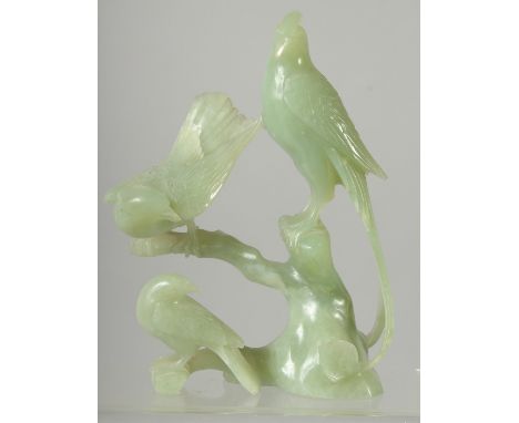 A CHINESE CARVED JADE BIRD GROUP on hardwood stand, 21cm high overall.