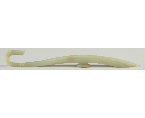 A LONG CARVED JADE BELT HOOK, with dragon head, 25.5cm long.