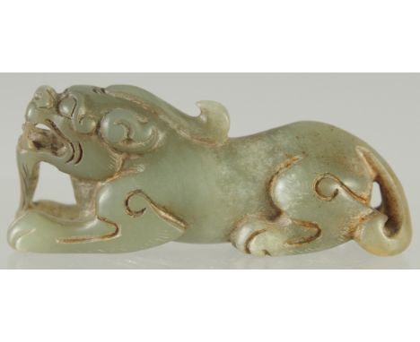 A CARVED JADE LION DOG, 7.5cm long.