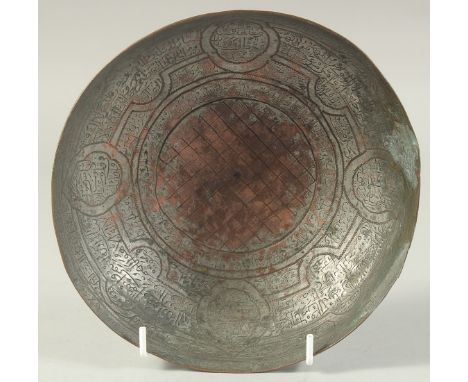 AN 18TH CENTURY PERSIAN SAFAVID ENGRAVED TINNED COPPER MAGIC BOWL, 18.5cm diameter.