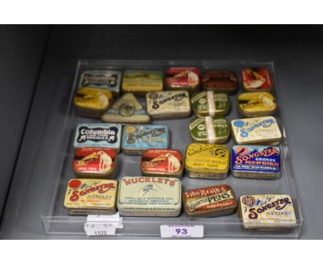 An assortment of vintage gramophone needle tins and similar advertising tins.