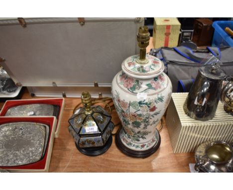 Two lamp bases, including metallic finish lamp with gilt flowers and oriental ceramic lamp with floral decoration.