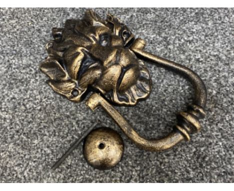 A reproduction cast metal 10 Downing Street knocker in the form of a lion