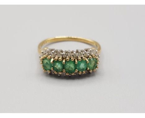 Ladies 9ct yellow gold green stone + Diamond cluster ring comprising of 5 oval green stones set in the centre surrounded by 2