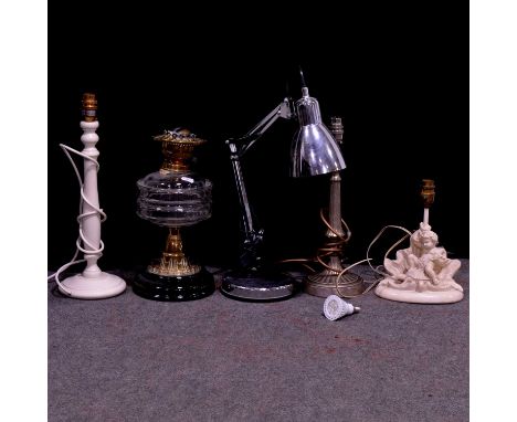 Five assorted lamps, including a Victorian glass and brass oil lamp, 33cm, a modern chromed anglepoise desk light, two pedest