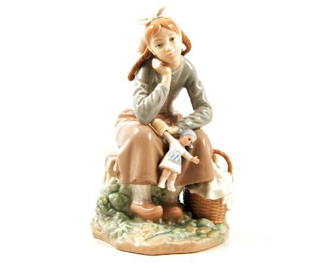 Lladro porcelain figure, pensive girl sitting on bench, with picnic basket and holding a doll, 23cm.Condition report:The item