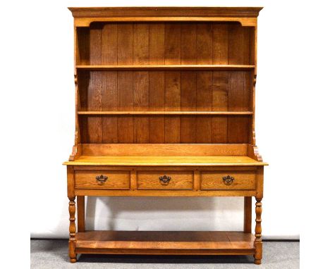 Haselbech Oak dresser, light blonde oak, the panelled back with two plate racks, above an open base with three short drawers 