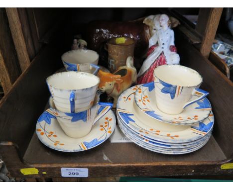 A Doulton Slaters 'Good Luck' mug with swastika emblems, a Royal Doulton figure 'The Ermine Coat' HN1981, a Melba ware figure