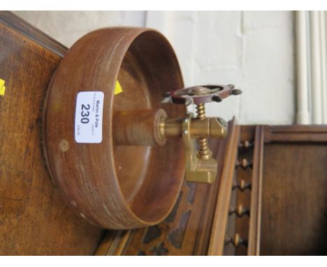 A turned wood and brass nutcracker bowl, in the form of a ship's wheel, 21cm diameter 