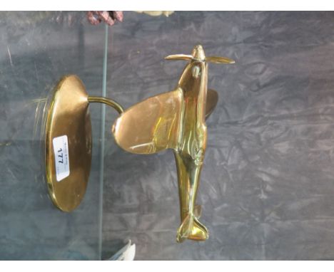 A brass model of a spitfire, on a stand, made by Bates Brass of Birmingham, 19cm long 