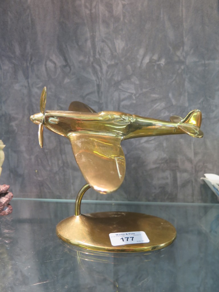 A brass model of a spitfire, on a stand, made by Bates Brass of ...