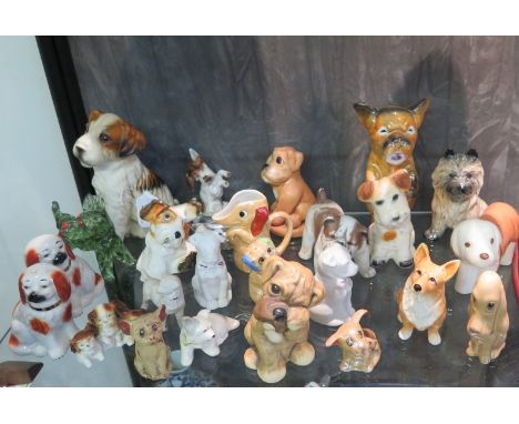 A collection of model dogs, including Staffordshire, Sylvac and others