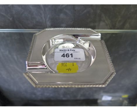 A silver ash tray with engine turned decoration 