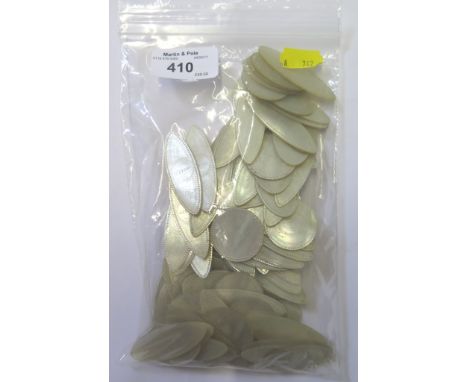 A collection of mother of pearl gaming counters