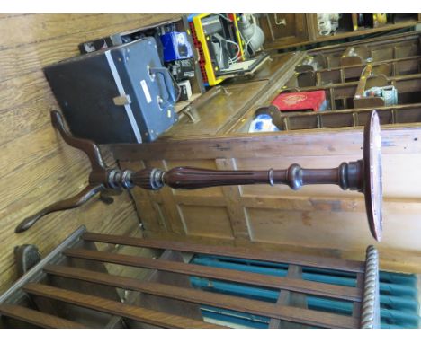 A mahogany torchere stand with baluster stem and tripod base 105cm high, and a Victorian toilet mirror with bobbin turned sup