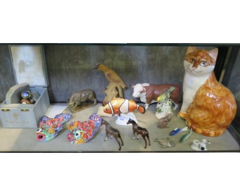 A Royal Corwn Derby figure 'Blue Tit and Chicks', signed under base K. Wood 10cm high, a Babbacombe figure of a cat, a Beswic