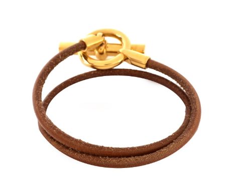 Hermes Tan Leather Toggle Double Tour Bracelet. Gold tone hardware. Box included. Signed. Measures 15" L. Condition: Light we