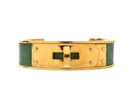 Hermes Epsom Leather Kelly Cuff Bracelet. Gold finish on Stainless Steel Without Nickel. Box included. Signed appropriately. 