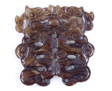 A Chinese carved and pierced jade pendant, length 5.5cm 