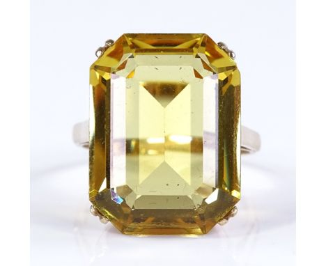 A 9ct gold large citrine dress ring, citrine length 20mm, size P, 7.5g 