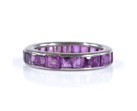 An unmarked white metal square-cut ruby full eternity ring, settings probably white gold, band width 3.9mm, size K, 3g 