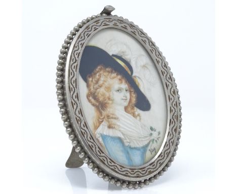 An oval miniature painted portrait of Lady Devonshire, in nickel plate frame, overall length 11.5cm 