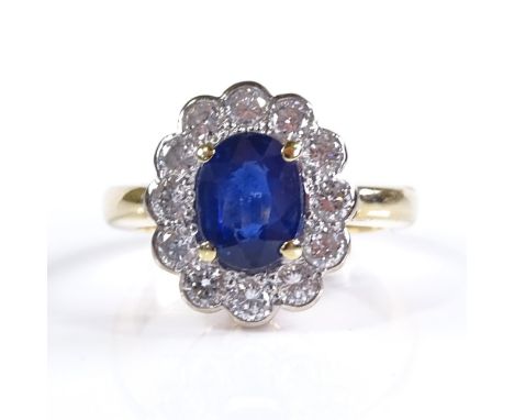 An 18ct gold sapphire and diamond cluster ring, oval-cut sapphire approx 1.59ct, total diamond content approx 0.81ct, setting