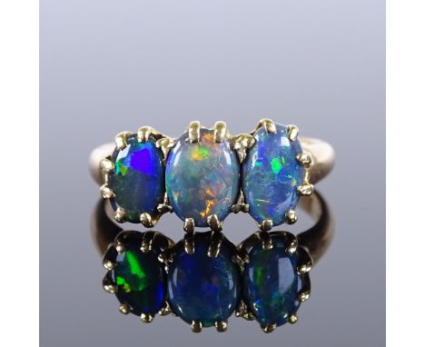 A 15ct gold 3-stone black opal dress ring, setting height 8.75mm, size O, 3.5g 