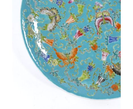 A Chinese blue glaze porcelain charger, with painted enamel butterflies and flowers, 6 character mark, diameter 33cm 