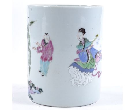 A Chinese white glaze porcelain brush pot, with painted enamel figures and gardens, height 12.5cm, diameter 10cm 