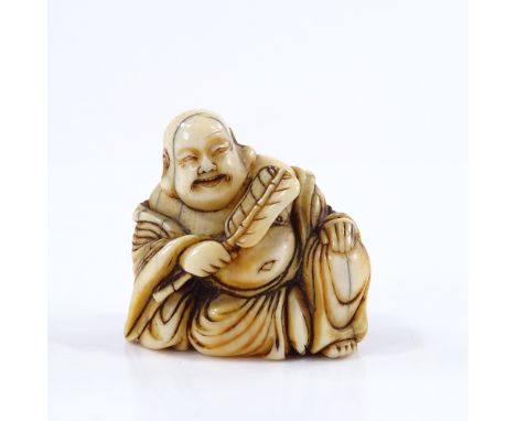 A Japanese 18th century ivory netsuke, in the form of a Hotei with a fan, height 3cm 