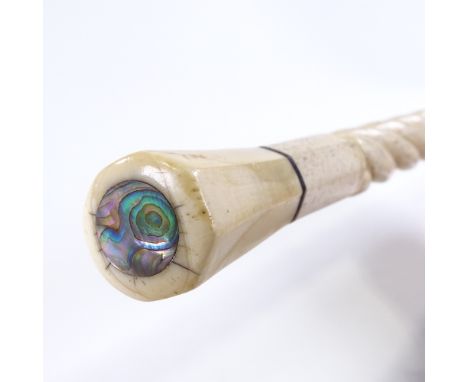 A 19th century marine ivory walking stick with spiral twist design, tapered octagonal ivory handle and inset shell top, lengt