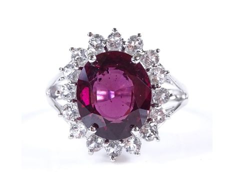 A 9ct white gold garnet and white stone cluster ring, setting height 18mm, size N, 4.4g 