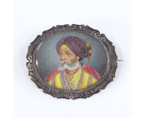 A 19th century miniature watercolour on ivory, portrait of a Sikh wearing a turban, unmarked engraved silver frame, width 50m