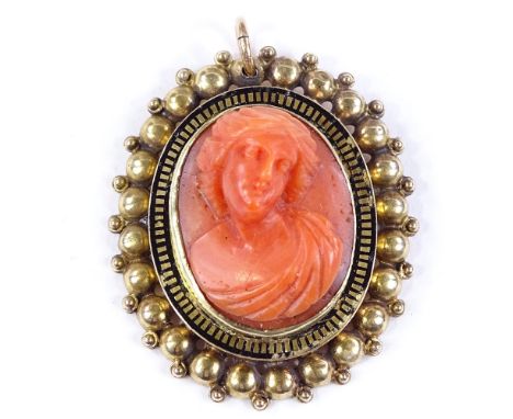 A high relief carved coral pendant, depicting female bust, in unmarked gold and black enamel frame, length 38.3mm, 9.3g 