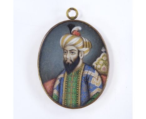 A 19th century Indian miniature watercolour on ivory, portrait of a man wearing a turban, in unmarked gilt-metal frame, heigh