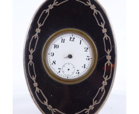An Edwardian tortoiseshell and silver-cased travelling clock, with enamel dial and stained wood back, height 12cm, no hands 