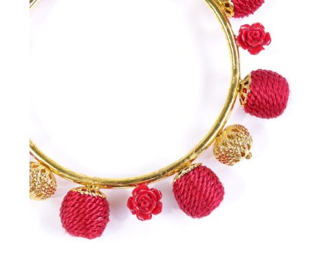 A Dolce &amp; Gabbana brass and red rope bangle, internal diameter 65mm, boxed 
