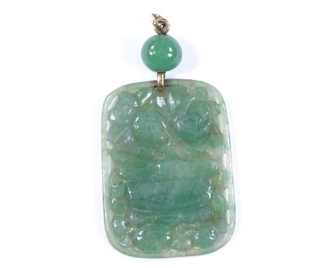 A carved jade panel pendant, with pierced floral scene, with unmarked gold mounts, panel height 44.1mm, 14g 