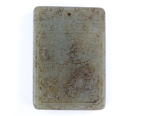 A Chinese jade tablet with relief carved decoration and text, length 6.5cm 