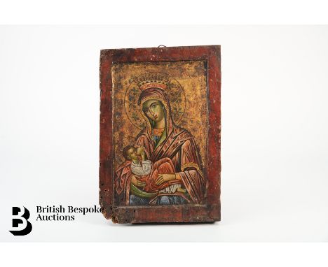 An 18th century Russian Orthodox icon, half-length portrait of the Mother of God, dressed in scarlet and blue robes, finely p